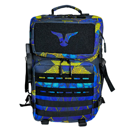A tactical backpack with a geometric pattern in blue, black, and yellow colors, featuring multiple compartments and MOLLE webbing.